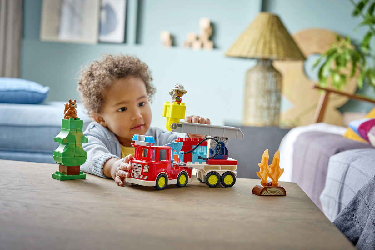 Fire Truck with Hose and Firefighter